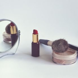 An image of common cosmetics item besides a mirror.