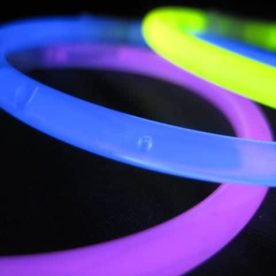 A purple, blue and green glow jewelry rings overlapping.
