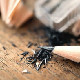 Shavings of pencil lead from a pencil sharpener.