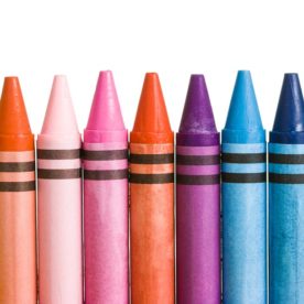 crayons in a row with white background