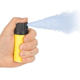 Someone spraying pepper spray.