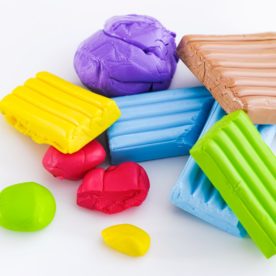 image of an assortment of polymer clay on a white background