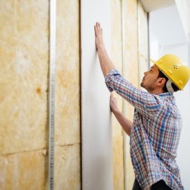 construction worker with drywall