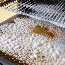 oven cleaner taking effect in an oven