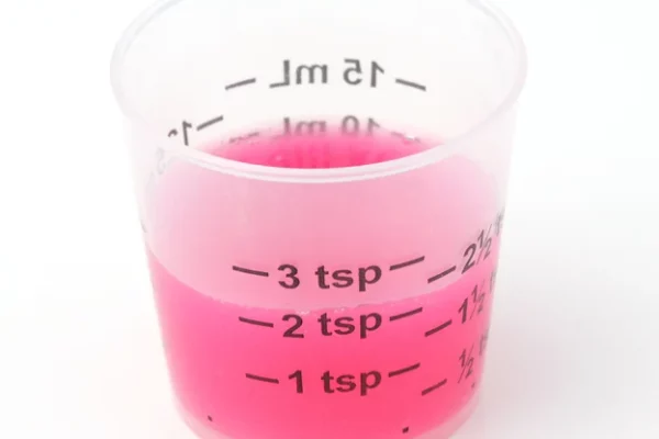 Pink liquid medicine that looks like Pepto Bismol