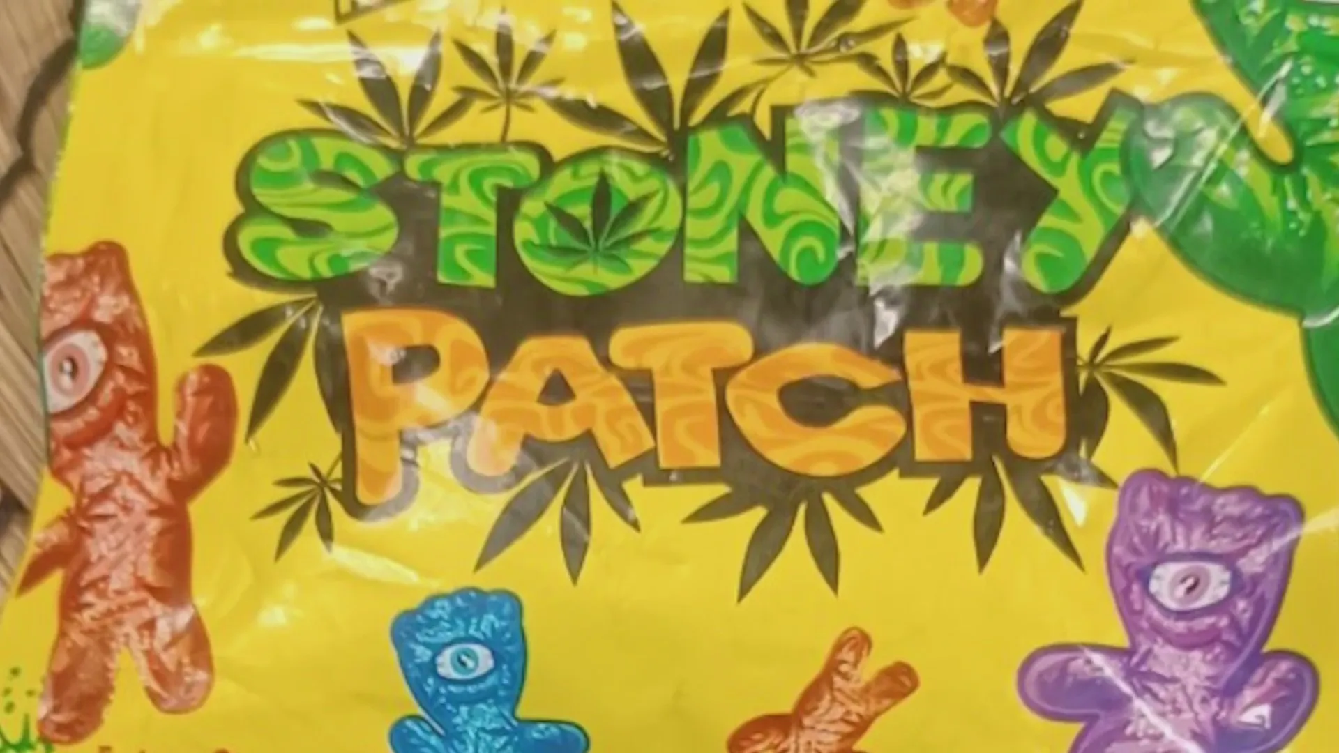 Packaging for 'Stoney Patch' THC-infused candy, designed to resemble Sour Patch Kids, featuring gummy bear-shaped characters and marijuana leaf graphics on a yellow background.
