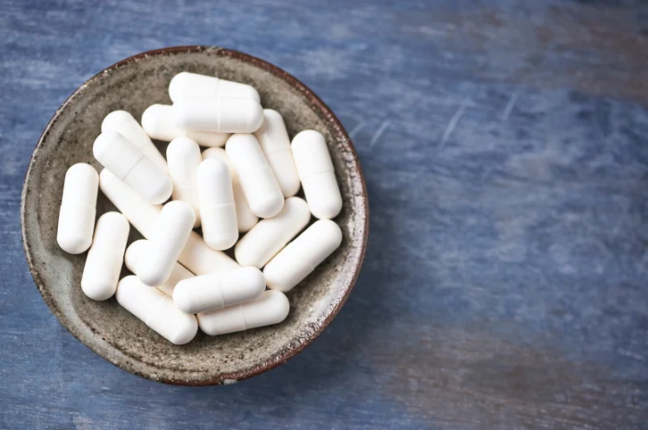 A bowl of white pills.