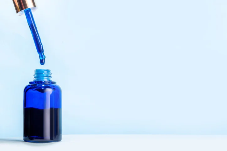 A dropper and bottle full of methylene blue.